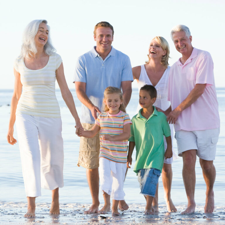 Extended family at the beach smiling